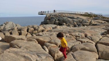 kid walking over rocks in albany, things to do with kids