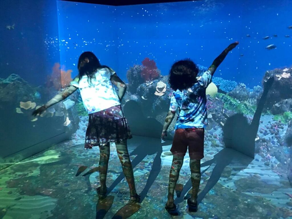 kids in front of aquarium of Maritime Museum