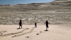 best things to do in lancelin: people in the sand dunes