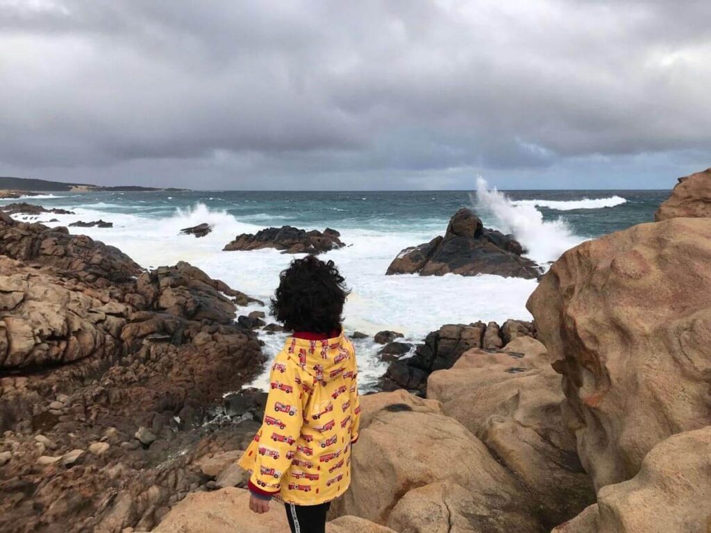 little boy in front of beautiful beach in yallingup