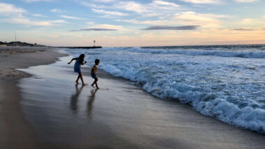 kid playing at the beach in perth