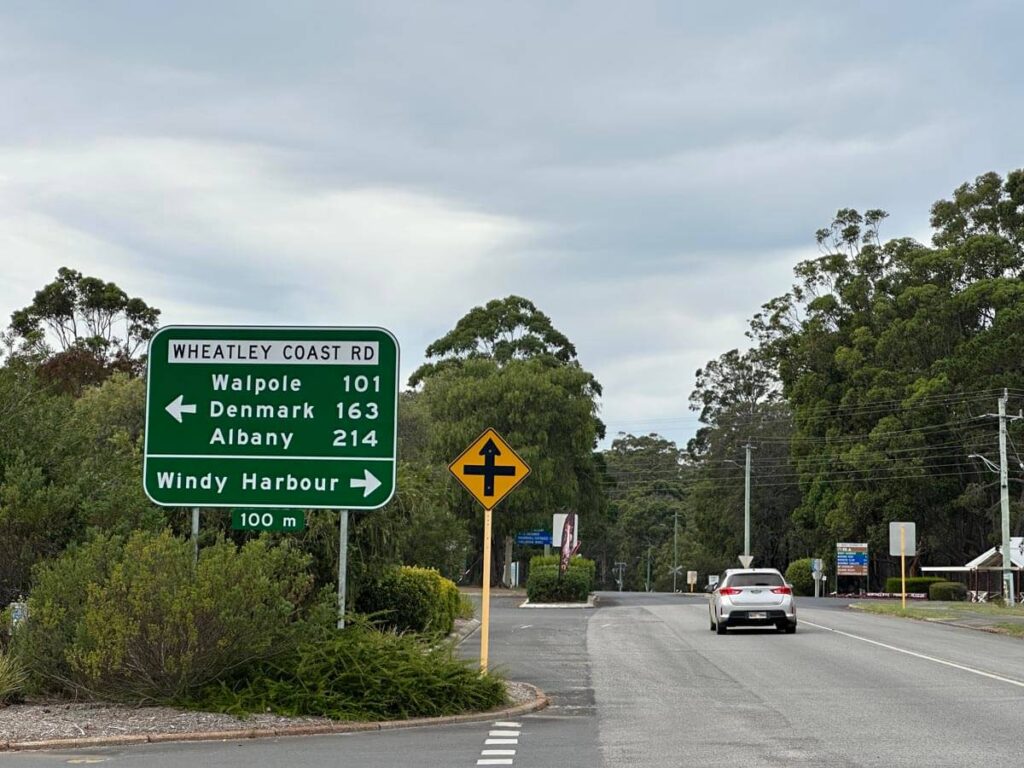A road sign on Wheatley Coast Road with km to Walpole Denmark and Alnaby